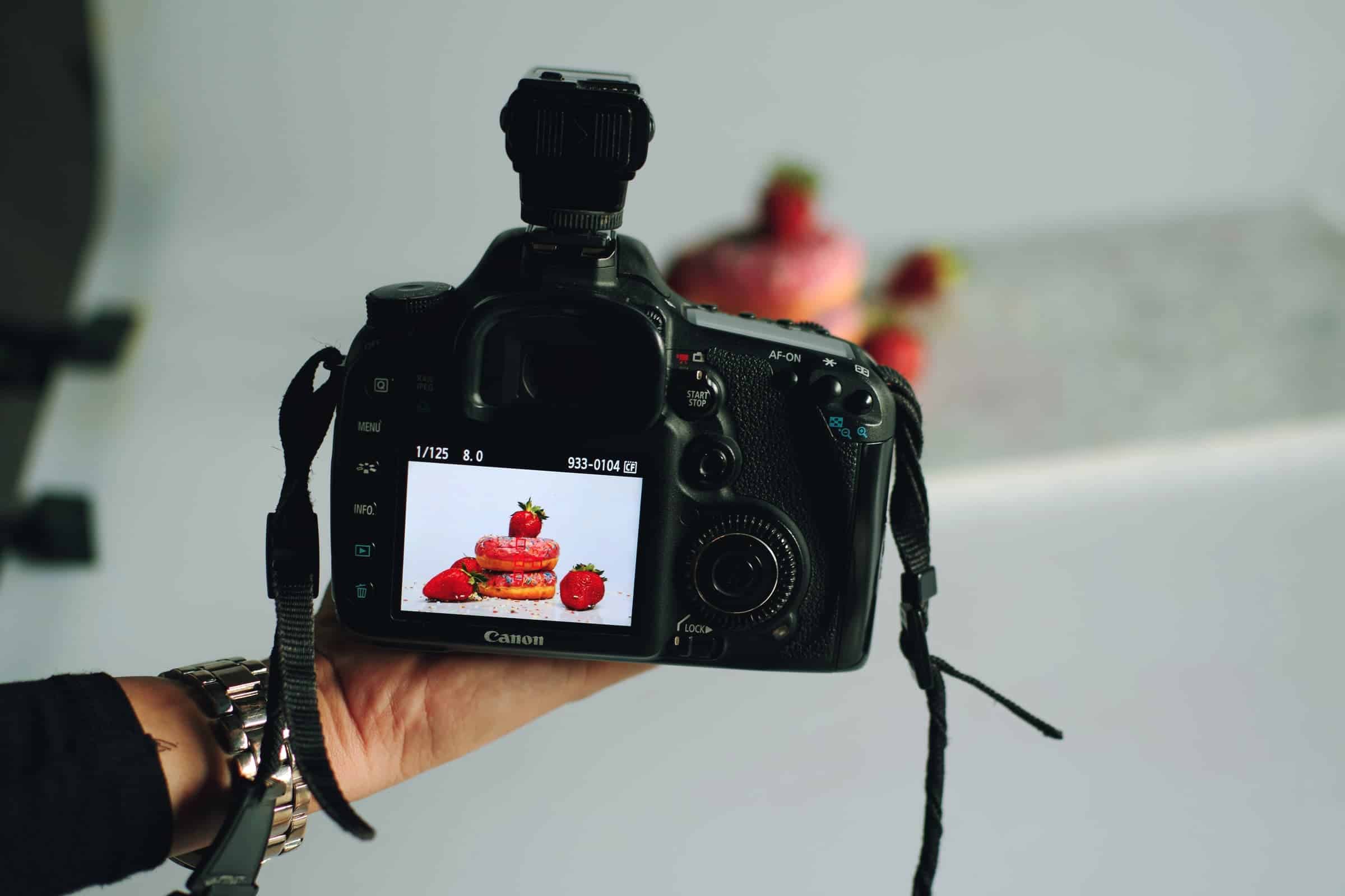 A photograph is being taken of strawberries.